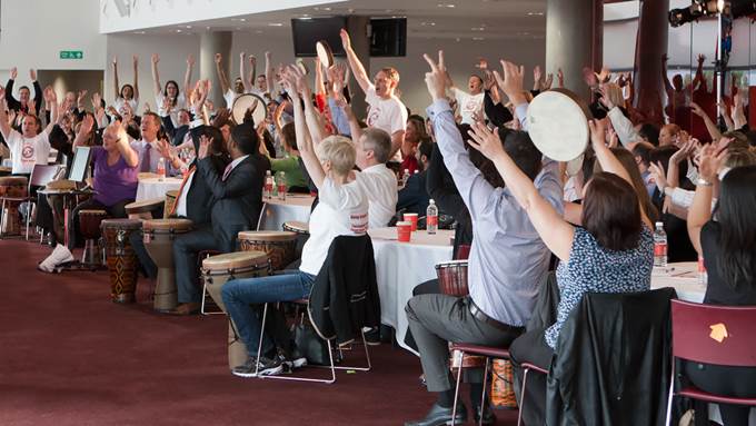 Conference delegates taking part in an energiser - how to keep conference delegates engaged