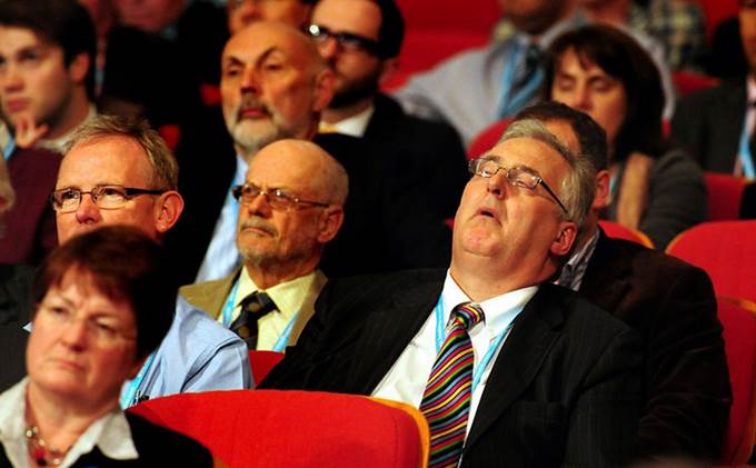 Man sleeping at a confenrece. How to keep conference delegates engaged.