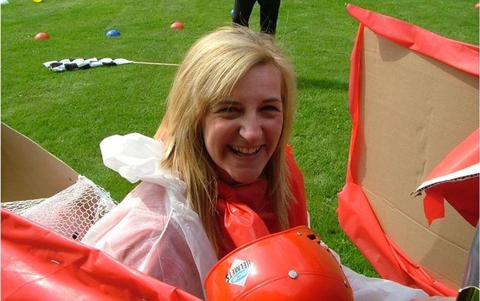 A wacky races contestant sitting in her vehicle