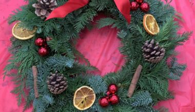 Photo of a Christmas wreath on a pink table cloth